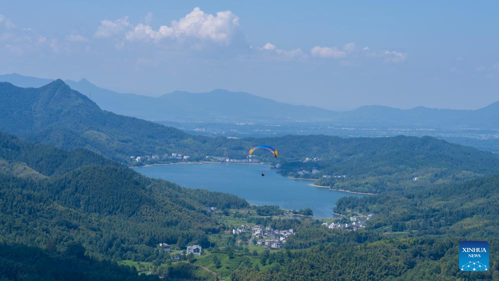 Tourists enjoy immersive aerial experience in Hongcun Village, E China