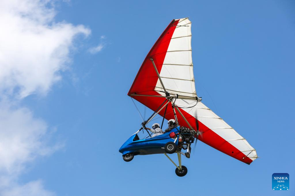 Tourists enjoy immersive aerial experience in Hongcun Village, E China