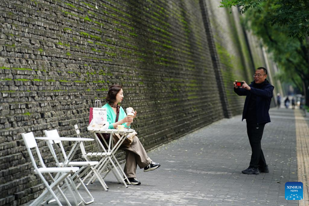 City wall covered with green coat attracts visitors in Xi'an, NW China