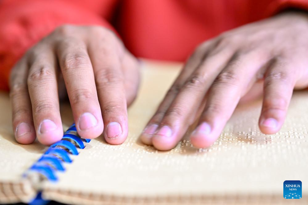 Music lights path for Xizang's first band composed of visually-impaired members