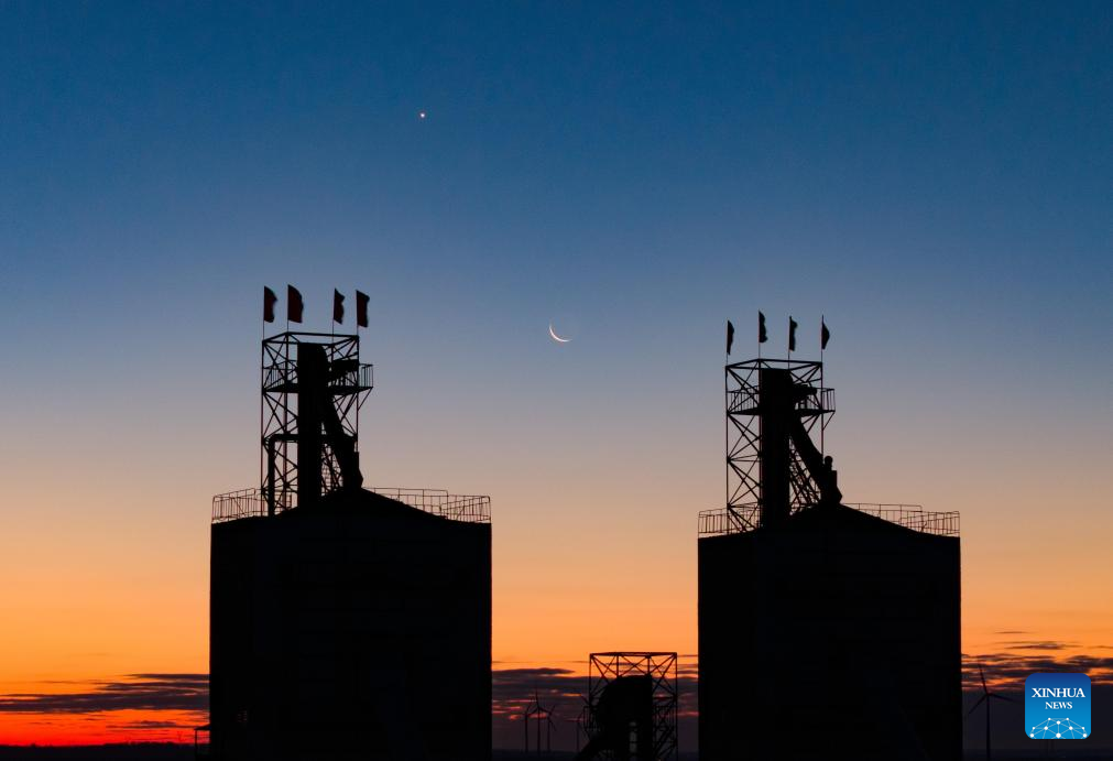 View of Venus next to moon in sky over NE China's Heilongjiang