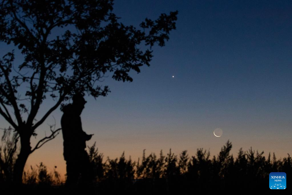 View of Venus next to moon in sky over NE China's Heilongjiang