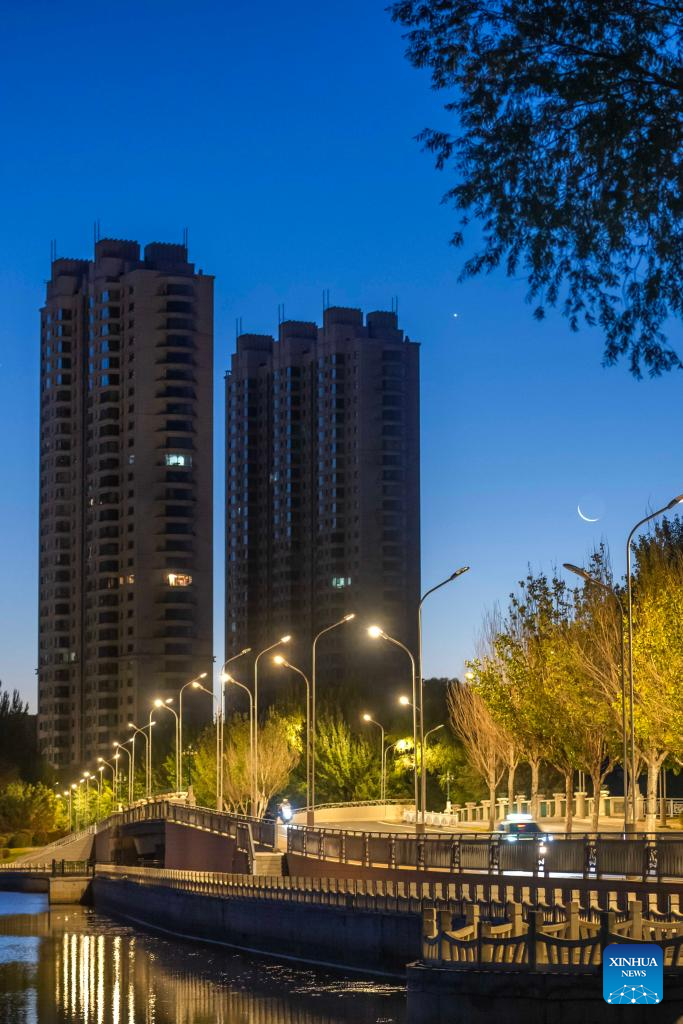 View of Venus next to moon in sky over NE China's Heilongjiang