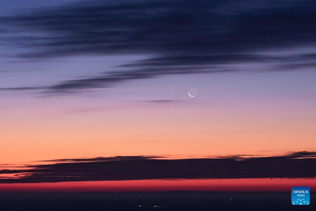 View of Venus next to moon in sky over NE China's Heilongjiang