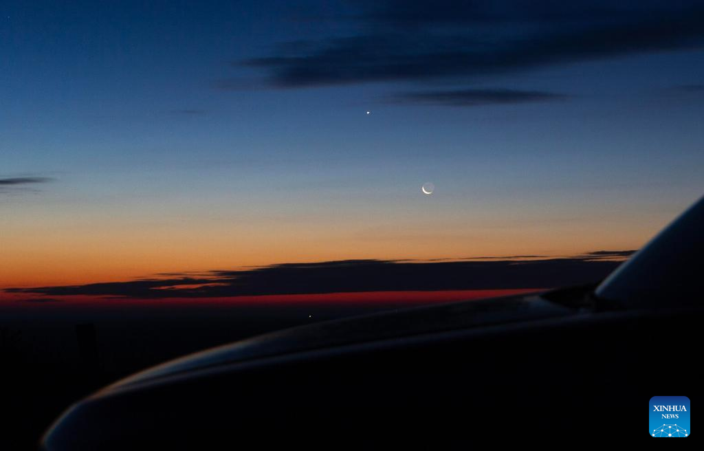 View of Venus next to moon in sky over NE China's Heilongjiang