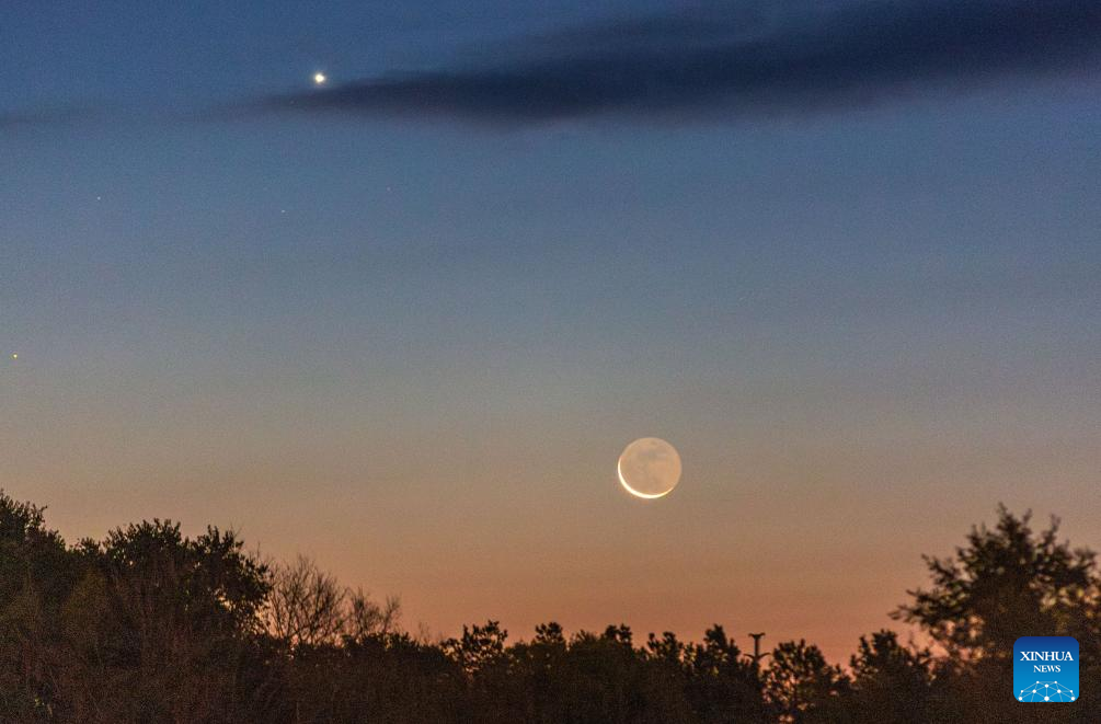 View of Venus next to moon in sky over NE China's Heilongjiang