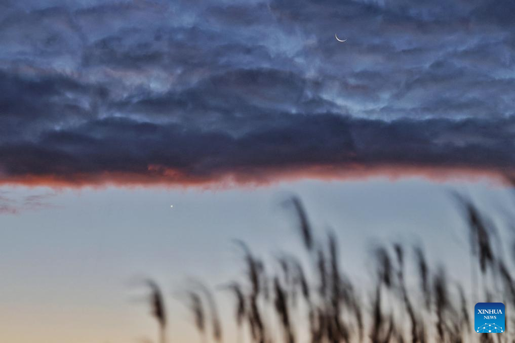 View of Venus next to moon in sky over NE China's Heilongjiang