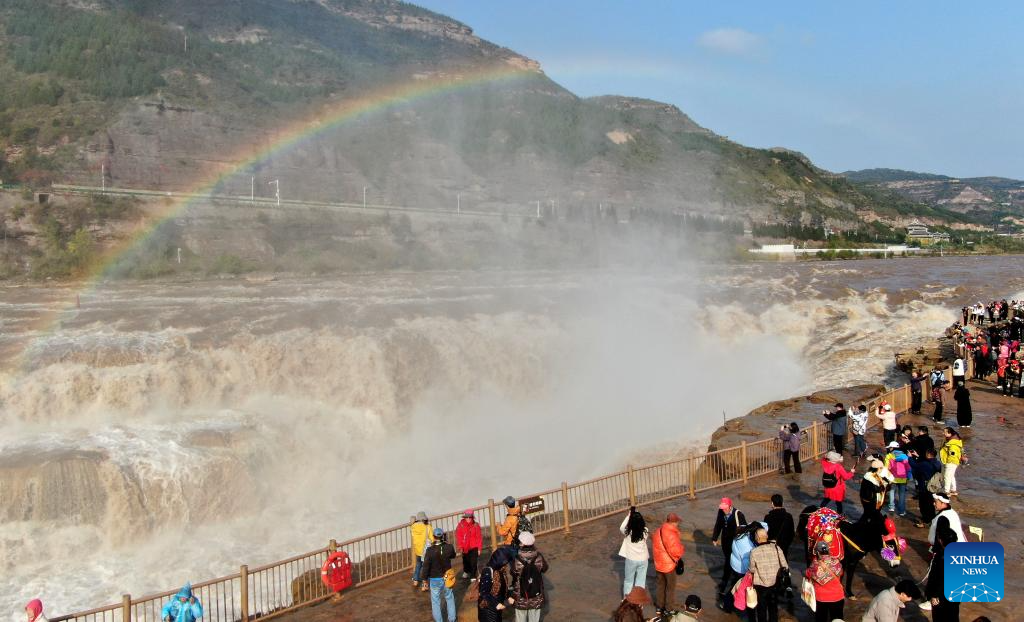 Scenery of rainbow over Hukou Waterfall in China's Shanxi