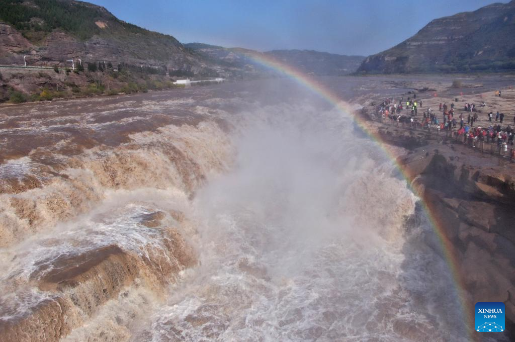 Scenery of rainbow over Hukou Waterfall in China's Shanxi