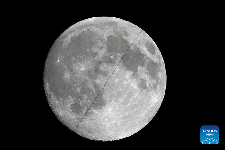 Chinese space station passes in front of Moon