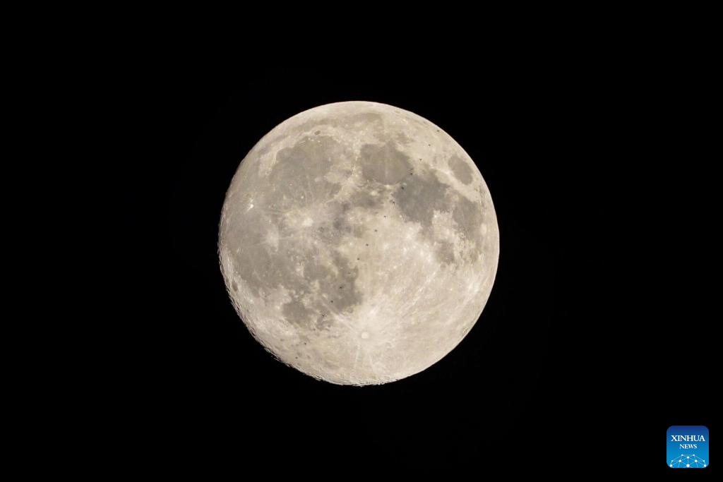 Chinese space station passes in front of Moon