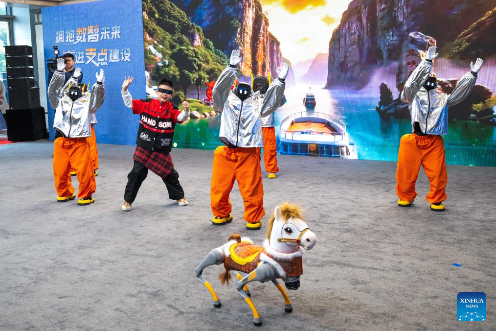 Electric vertical takeoff and landing aircraft, humanoid robots make debut in Wuhan, China's Hubei