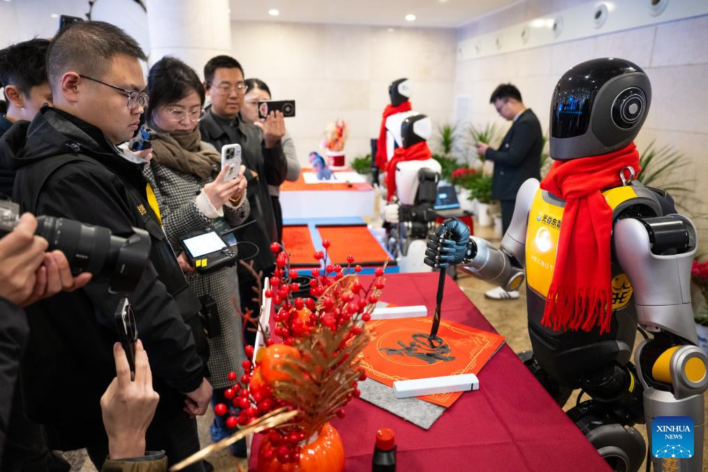 Electric vertical takeoff and landing aircraft, humanoid robots make debut in Wuhan, China's Hubei