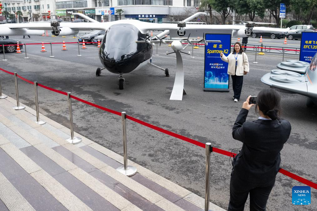Electric vertical takeoff and landing aircraft, humanoid robots make debut in Wuhan, China's Hubei