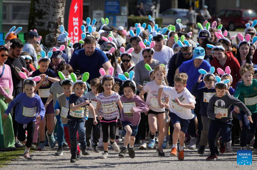 People take part in Big Easter Run at Jericho Beach in Canada