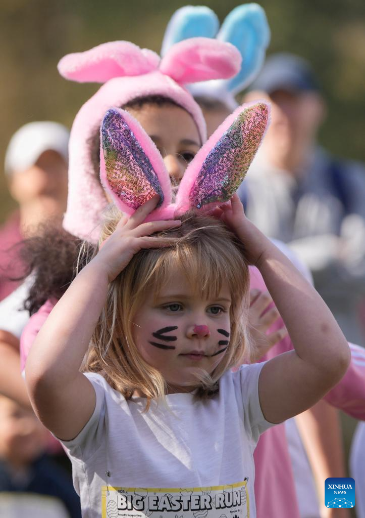 People take part in Big Easter Run at Jericho Beach in Canada