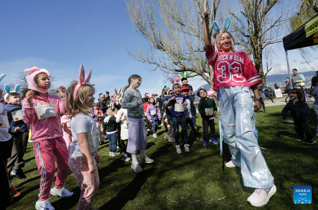 People take part in Big Easter Run at Jericho Beach in Canada