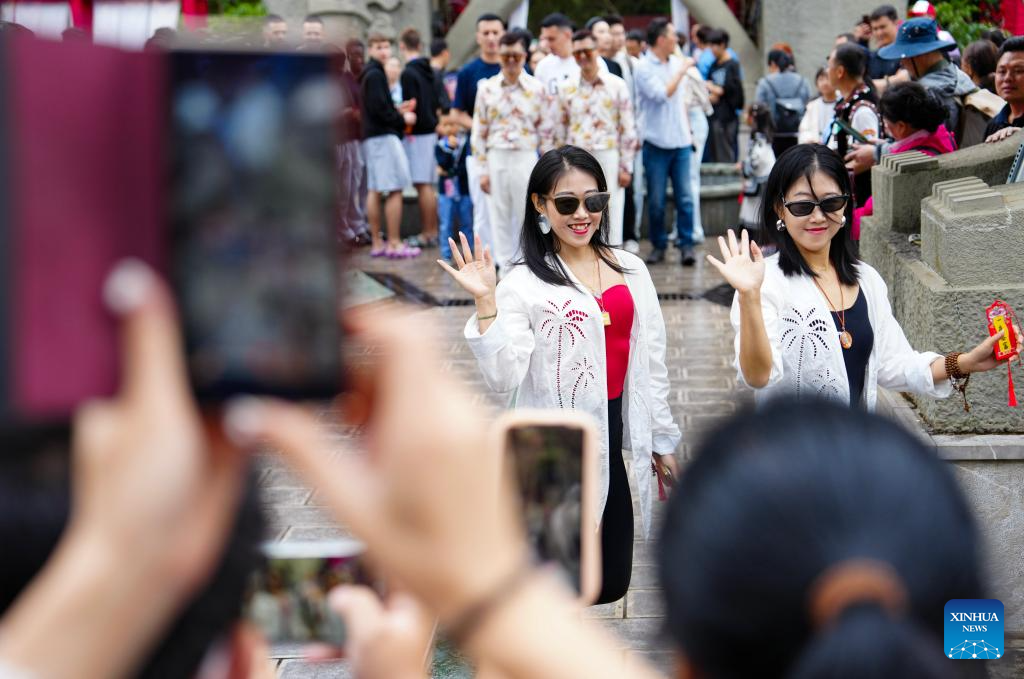 Twin festival lures tourists in SW China's Yunnan