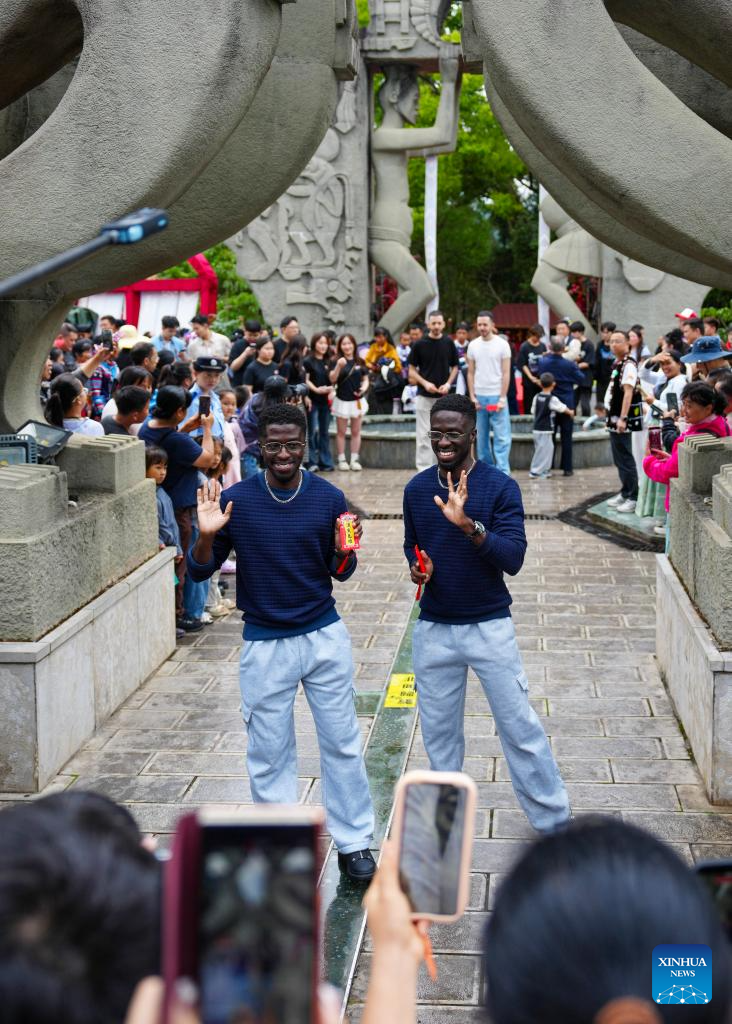 Twin festival lures tourists in SW China's Yunnan