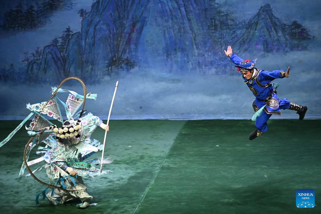 Artists perform Peking opera to mark