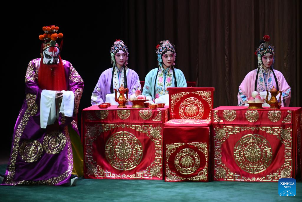 Artists perform Peking opera to mark
