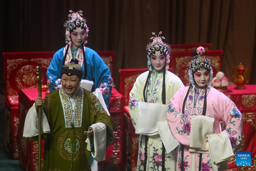 Artists perform Peking opera to mark