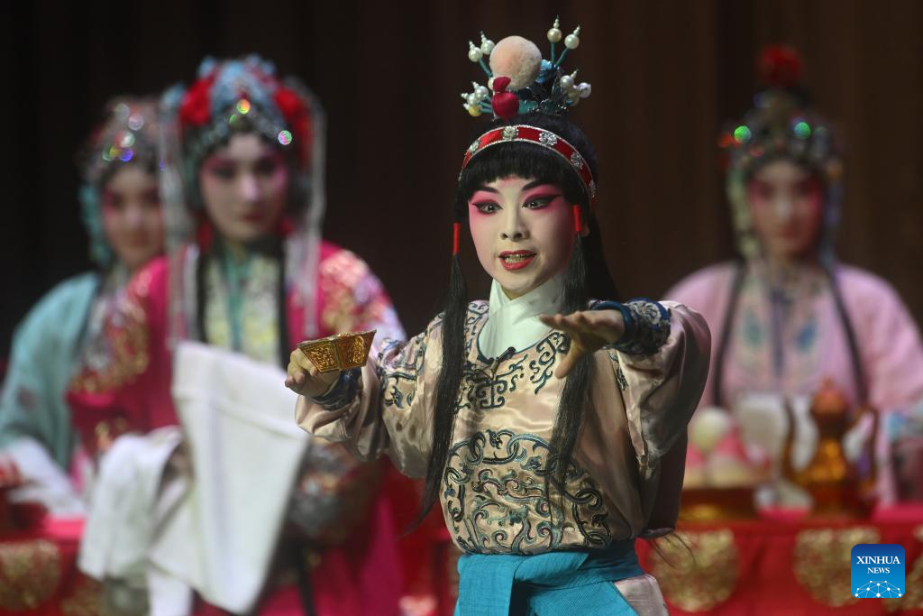 Artists perform Peking opera to mark