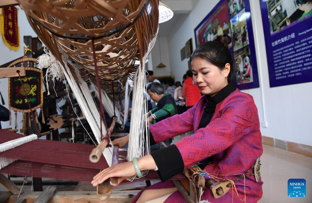 Pic story: inheritor of Zhuang brocade weaving technique in China's Guangxi