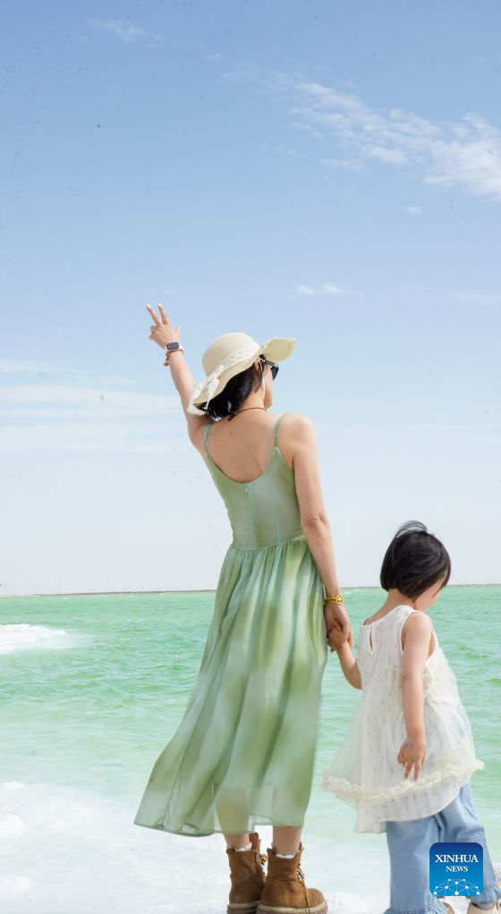 Tourists visit Qairhan salt lake in China's Qinghai